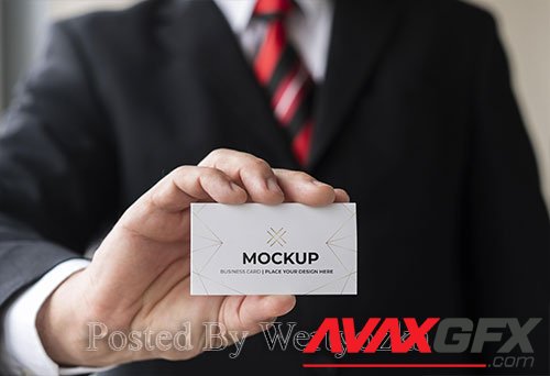 Close-up businessman holding business card mock-up with one hand