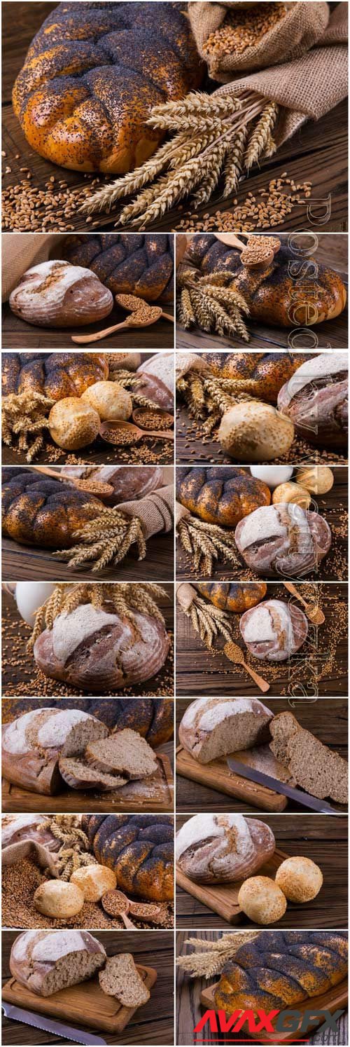 Wheat spikelets and fresh bread on wood background stock photo