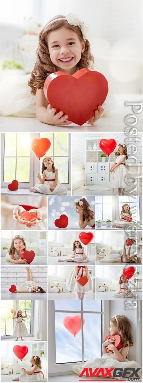 Smiling girl with red heart stock photo