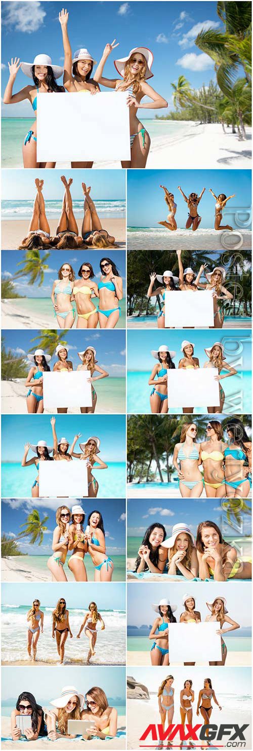 Young girls with white placard at the sea stock photo