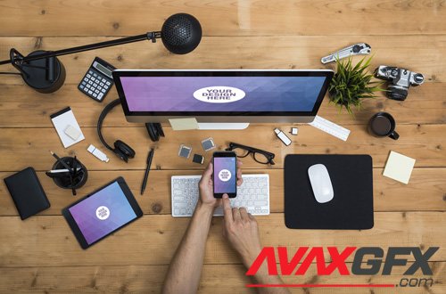 User with Desktop Computer, Tablet, and Smartphone on a Cluttered Wooden Table Mockup 2 124766571