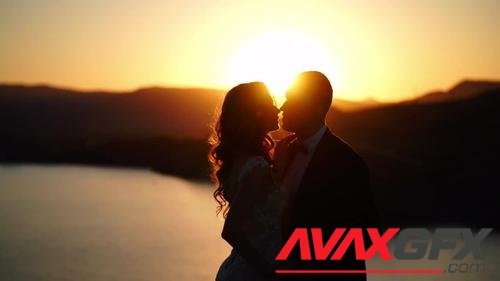 MotionArray – Newlyweds Kissing At Sunset 170671