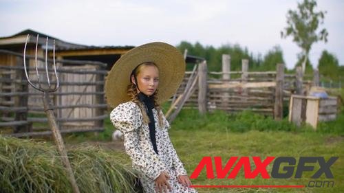 MotionArray – Country Girl Near Haystack With Hayfork 1026810