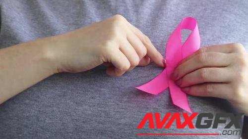 MotionArray – Woman Holding Pink Ribbon 1034787