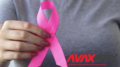 MotionArray – Woman Holds Pink Ribbon 1036066