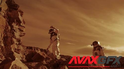 MotionArray – Astronauts Climbing Rocks On Mars 1048434