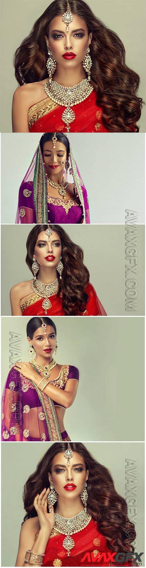 Luxurious indian girls in traditional dresses stock photo