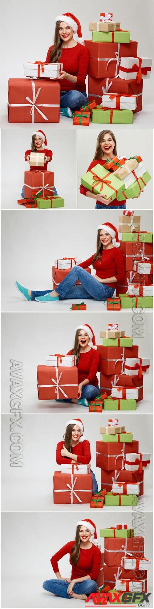 Girl near christmas boxes with gifts stock photo