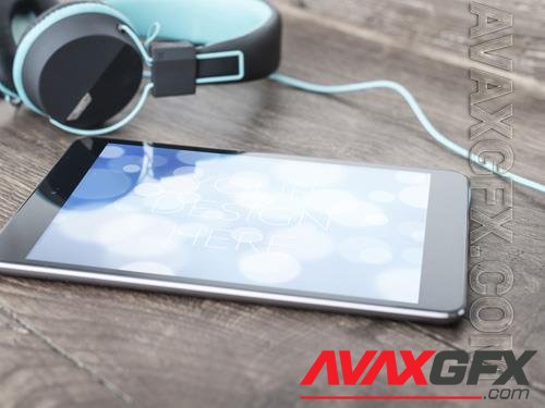 Tablet on Table with Headphones Mockup 215881968