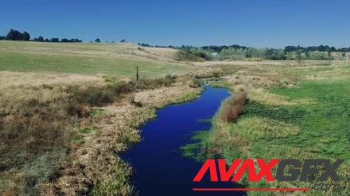Aerial view footage of a swamp lake river with green grass in a rural area of south africa 41195474