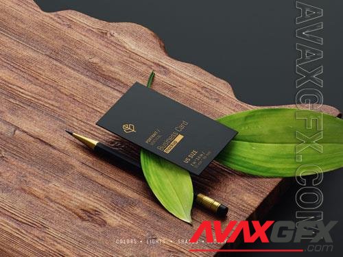 PSD vertical business card mockup with pencil and leaves