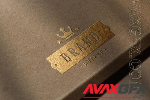 PSD luxury gold foil stamping logo mockup on beige kraft paper box surface