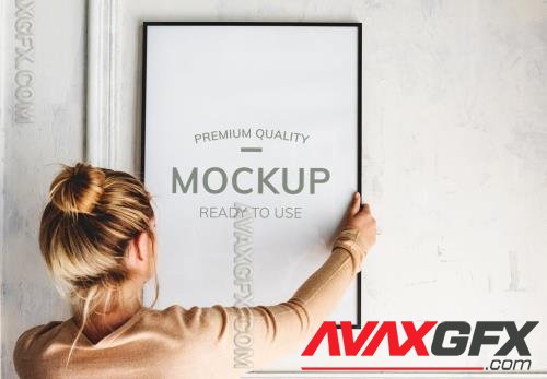 Woman Hanging a Frame Mockup 271328744 [Adobestock]