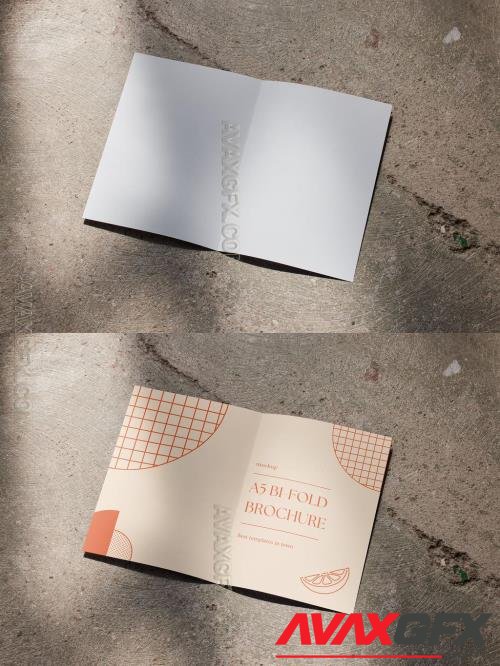 A5 Brochure Mockup Open on a Concrete Floor 544817594 [Adobestock]