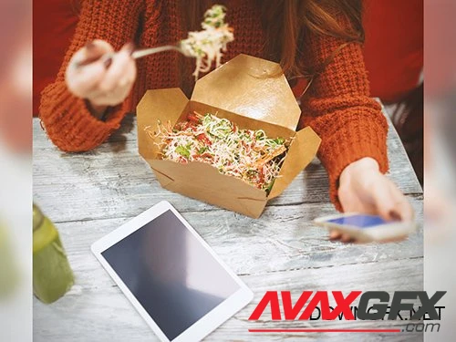 Woman Using Smartphone and Tablet While Eating Takeout Mockup 220158404